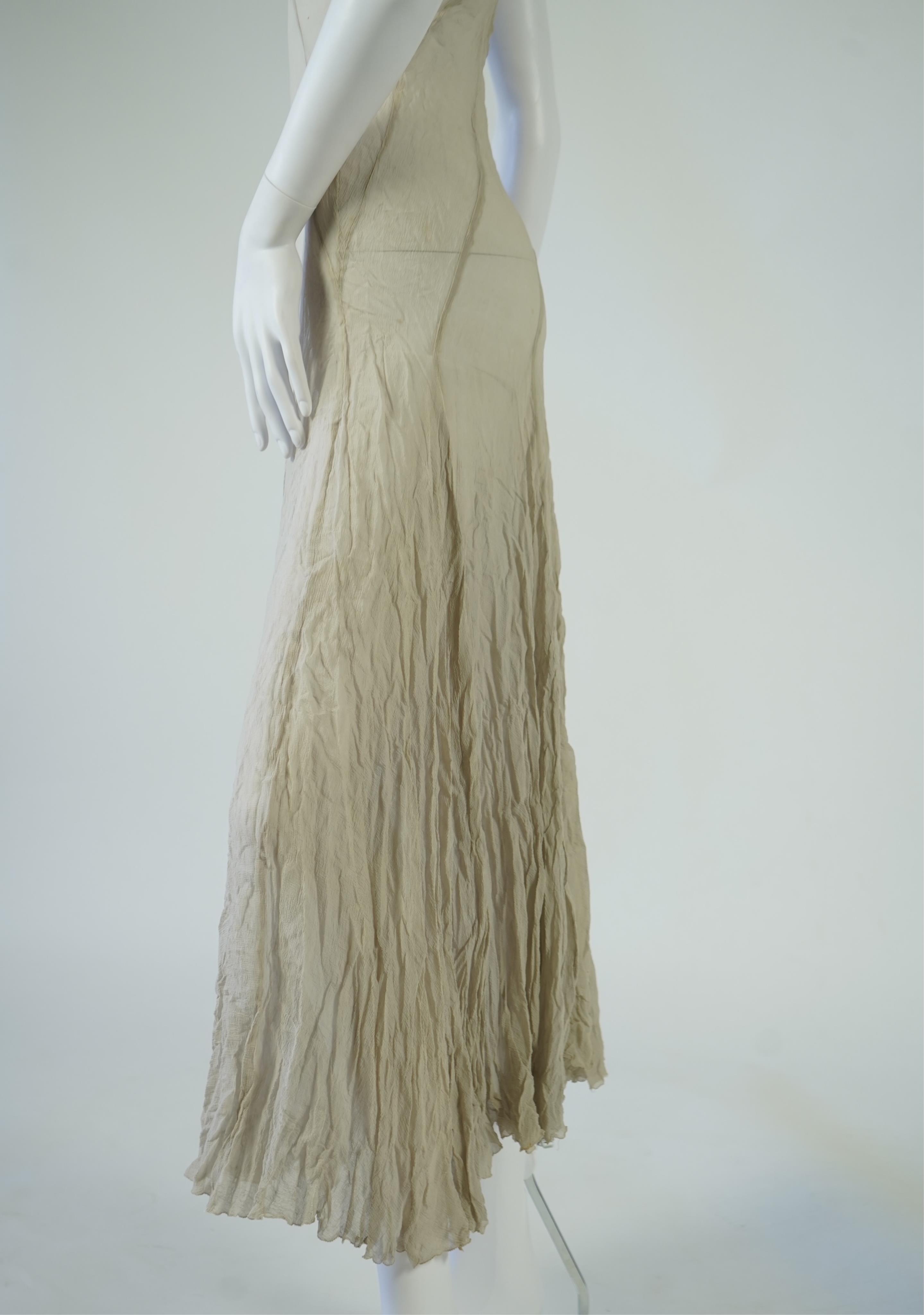A 1930's grey chiffon bias cut ladies evening dress. 120cm long. Condition - has a small hole at the back and a light mark possibly removed with washing.